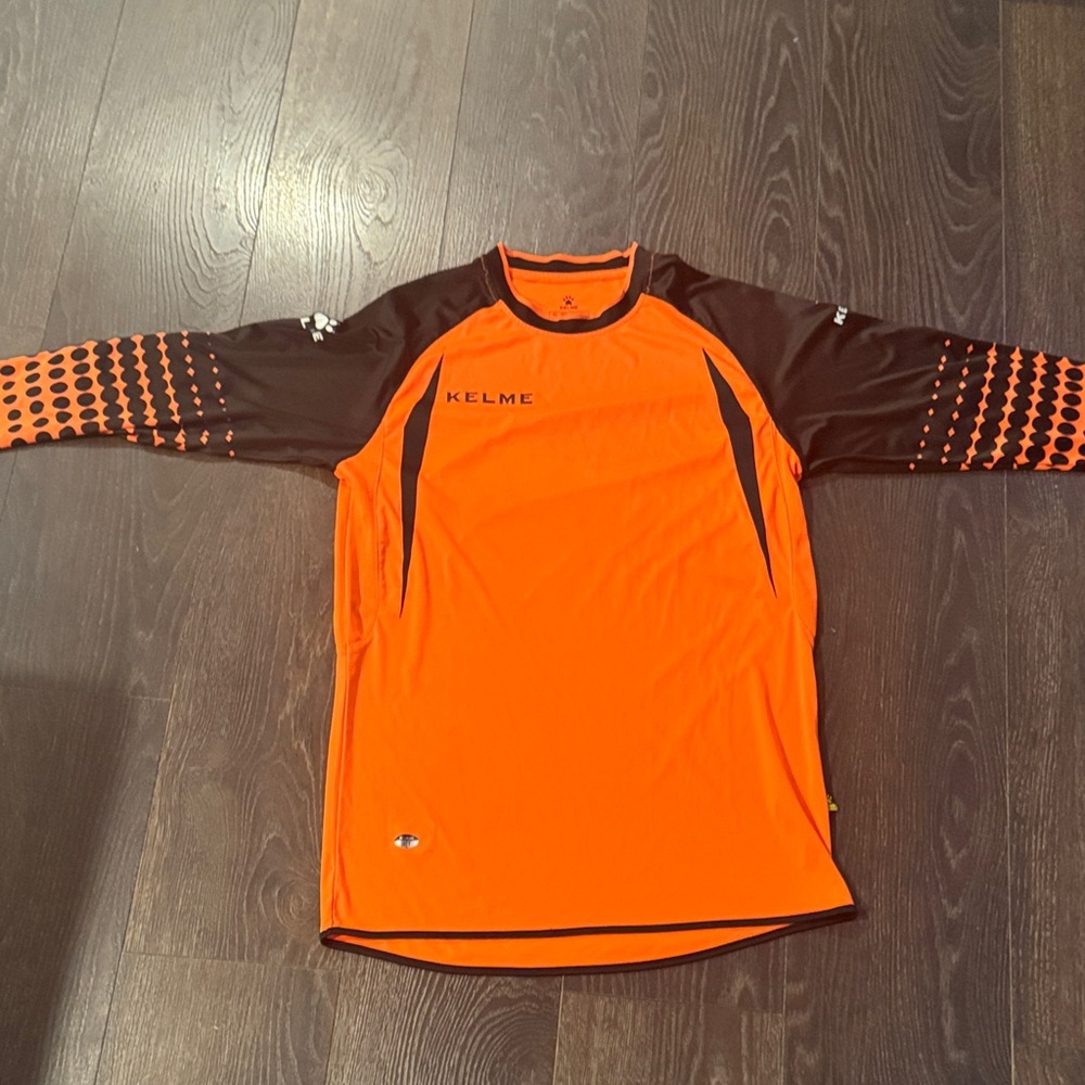 Kelme Men's Orange and Black Jersey with padding on arms